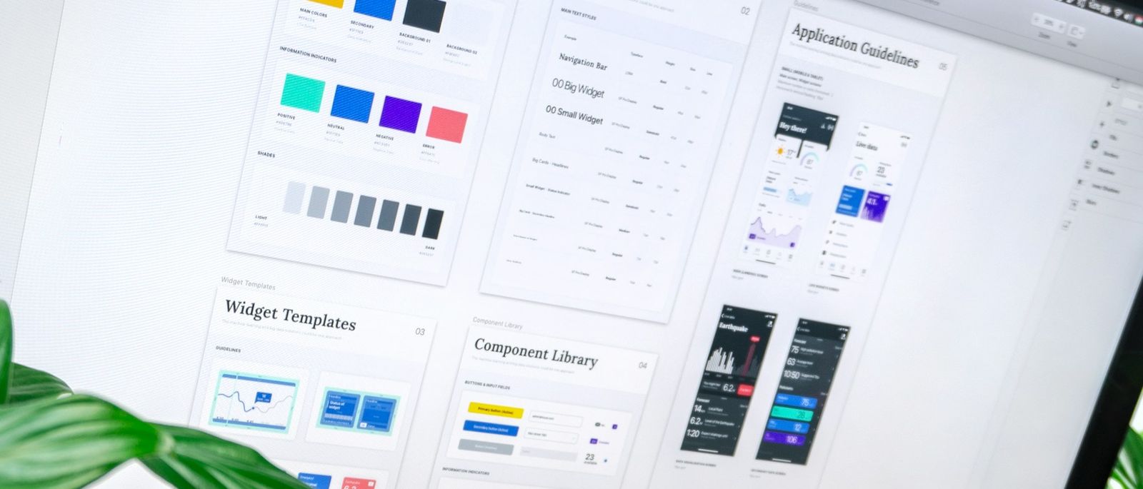A design system open on a monitor: colour tokens, text styles, widget templates and a component library