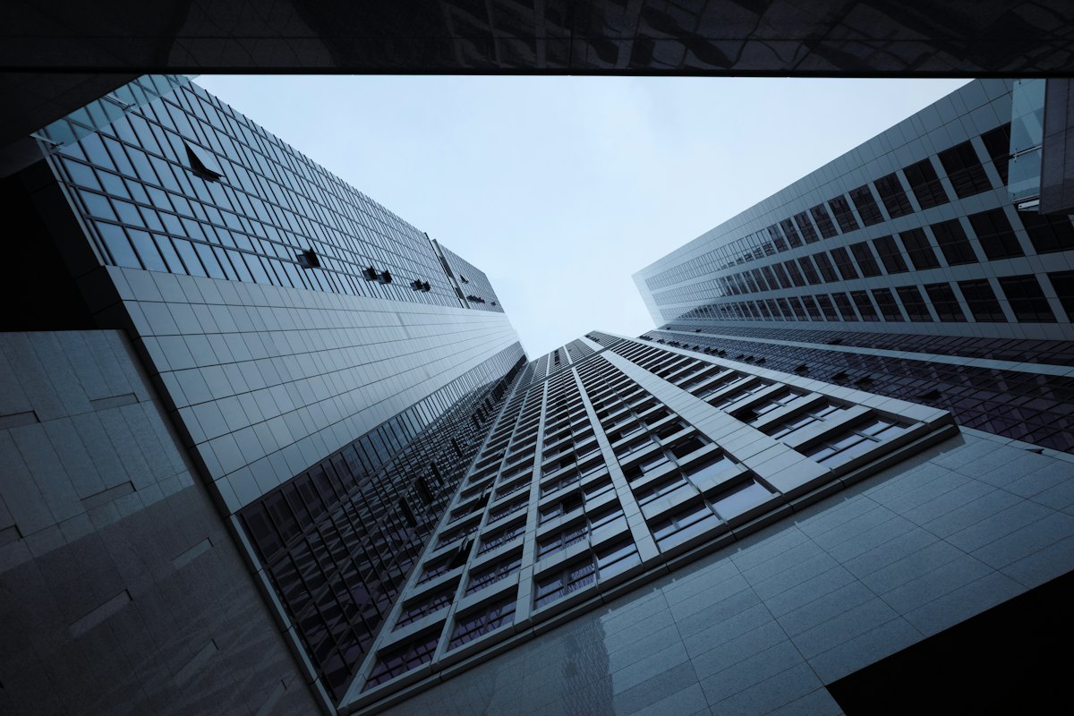 Office towers seen from street level, looking straight up