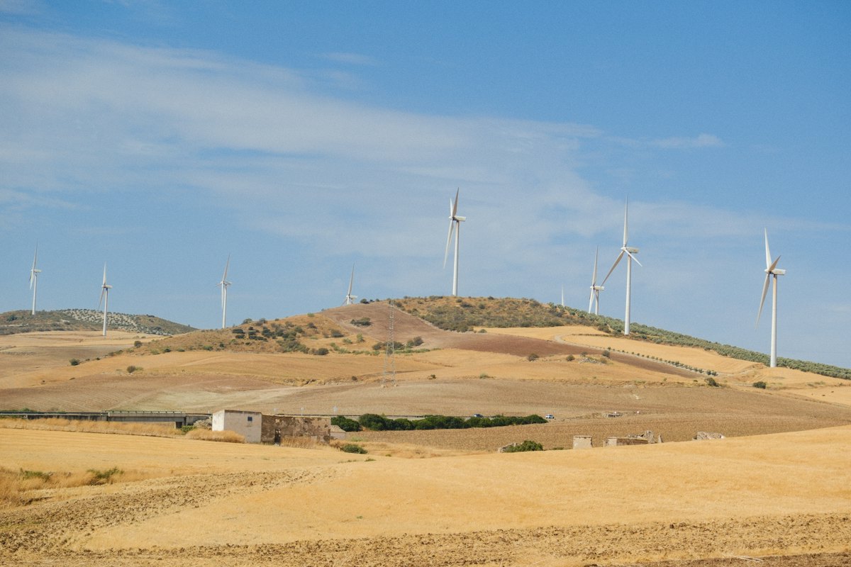 Wind turbines across a rolling landscape