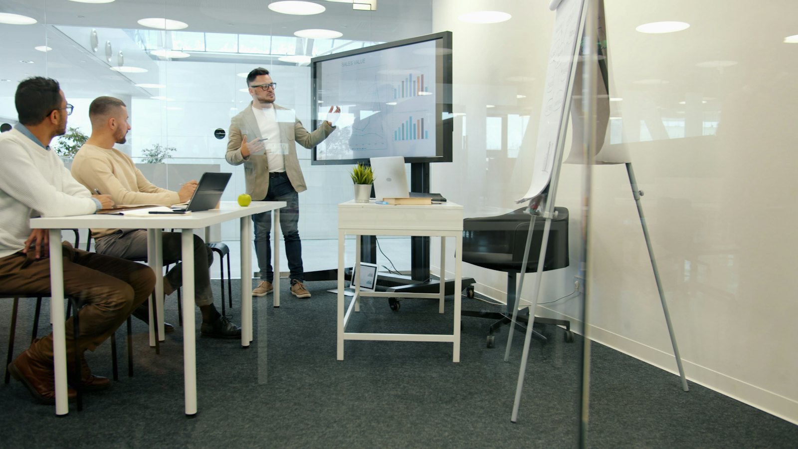 A leadership team in discussion around a table in natural light