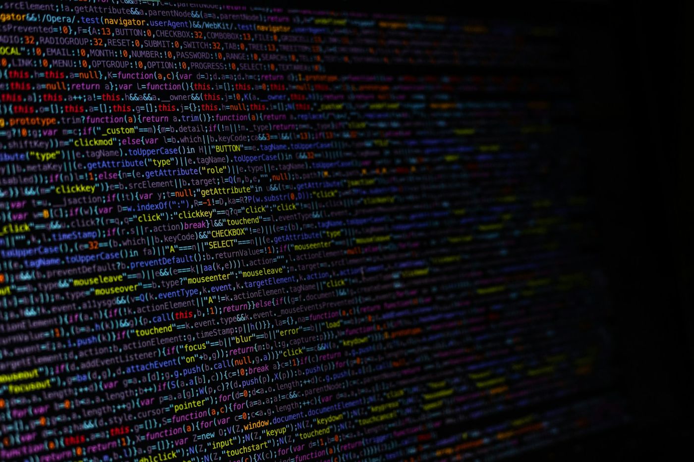 Lines of colourful code on a dark screen