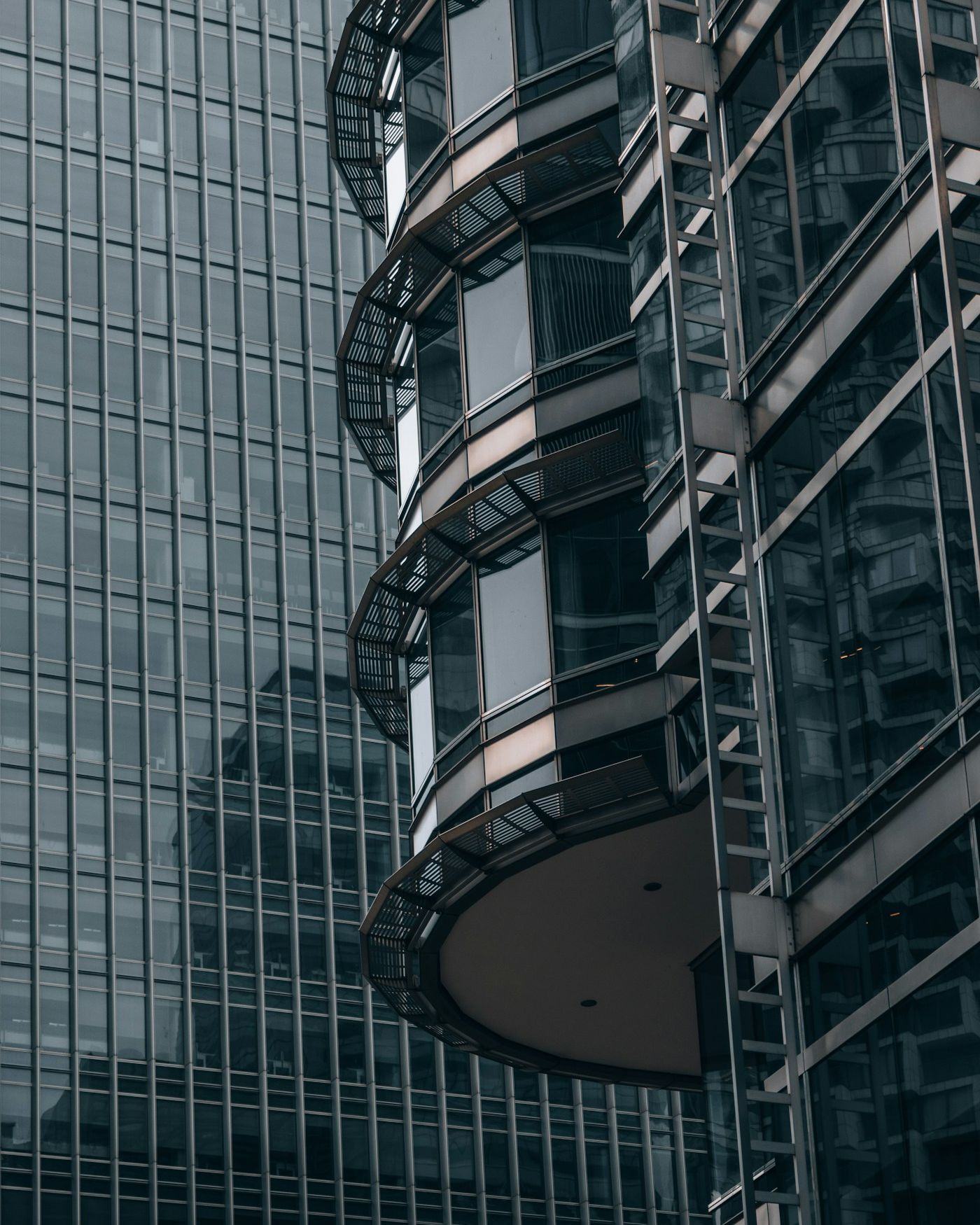 Looking up the glass and steel façade of a tall office tower