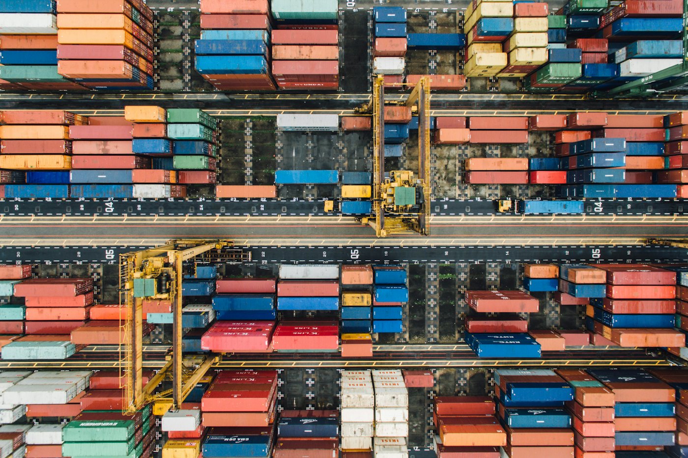 Shipping containers stacked in a port, seen from above