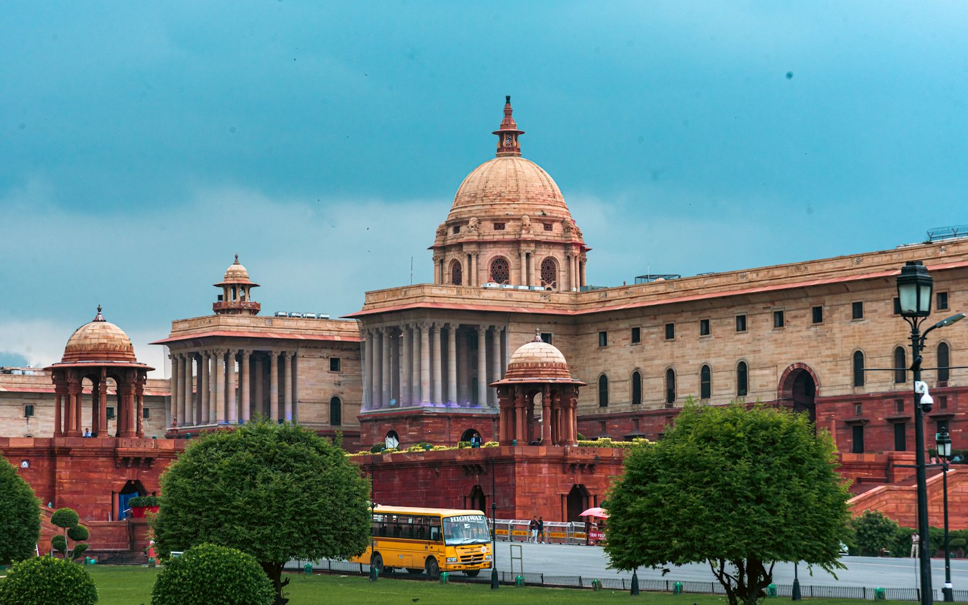 Government buildings in New Delhi under a cloudy sky